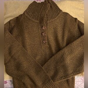 Women’s green winter sweater.